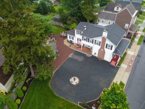 Aerial drone view of a Bordentown NJ home showing large driveway, backyard layout, and surrounding neighborhood positioning