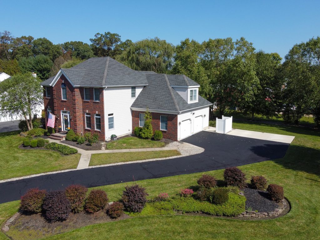 Hamilton NJ home elevated front aerial view showing curb appeal and property layout
