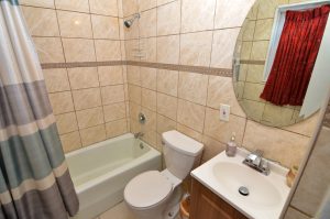Updated bathroom with tile surround and modern finishes in Roebling NJ