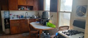 Older kitchen in Hamilton Township NJ home with wood cabinets and dated layout