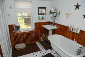 Bathroom in Bordentown NJ home featuring clawfoot tub and vintage details