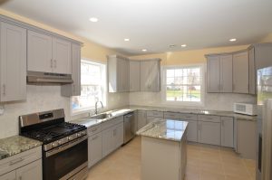 Modern kitchen in Florence NJ with gray cabinets and center island