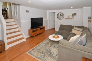 Finished lower level family room in Hamilton NJ home with seating area