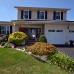 Hamilton Township NJ home with double garage and landscaped yard