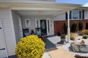 Front porch and entryway of a home in Hamilton NJ with seating and welcoming setup