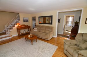 Living room in Hamilton Township NJ home with open layout and staircase