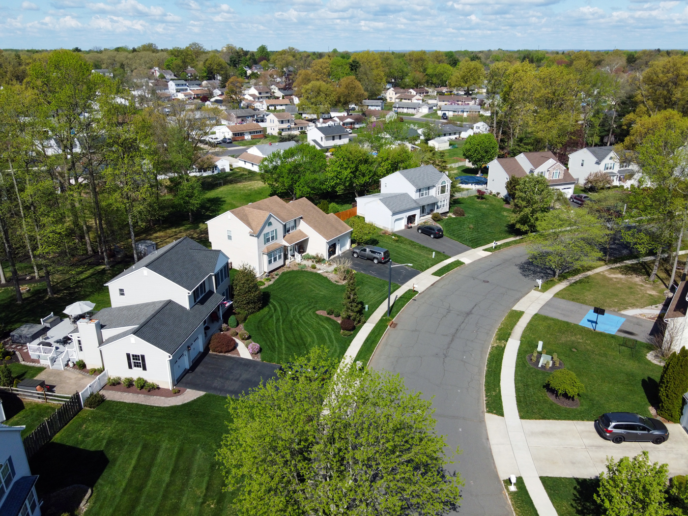 Aerial view of a residential street in Hamilton Township NJ showing neighborhood layout and surrounding homes