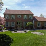 Brick colonial home in Hamilton Township NJ with landscaping