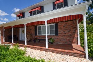 Home in Hamilton Township NJ with covered porch and brick exterior