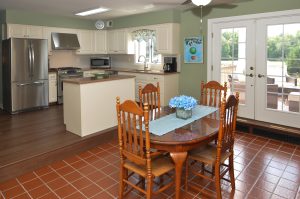 Bright and clean kitchen in Hamilton Township NJ with white cabinets, stainless steel appliances, and natural light