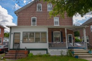 Brick twin home in Roebling NJ with front porch and historic architectural details