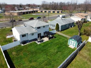 Aerial view of a Hamilton NJ split-level home with fenced backyard and surrounding neighborhood layout