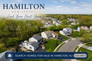Clickable image linking to homes for sale in Hamilton Township NJ featuring an aerial view of a residential neighborhood with single-family homes and tree-lined streets