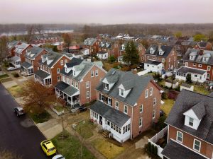 Aerial view of a residential neighborhood in Roebling NJ featuring rows of brick homes and distinct housing patterns