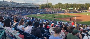 Fans gather to watch a Trenton Thunder baseball game on a summer evening in Mercer County, New Jersey.