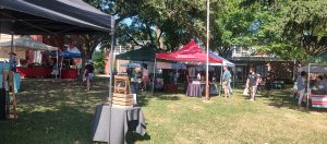 Residents shopping and visiting vendor tents at the Bordentown Farmers Market in Bordentown City NJ