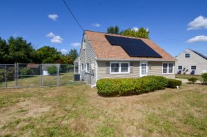 Residential home in Ewing NJ featuring rooftop solar panels
