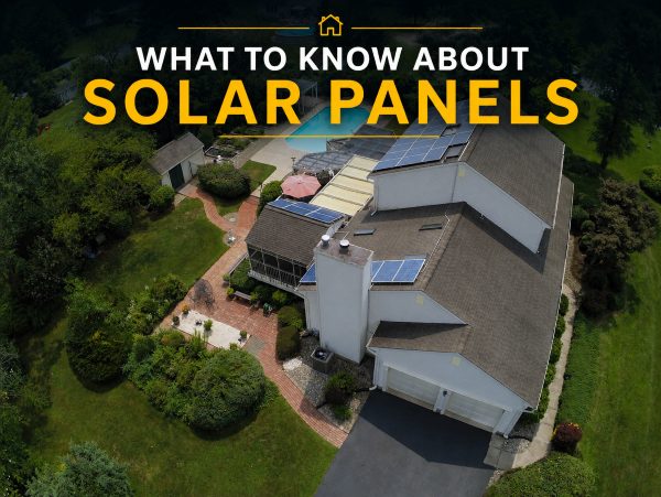Aerial view of Hamilton NJ home with rooftop solar panels, backyard pool, and outdoor living areas