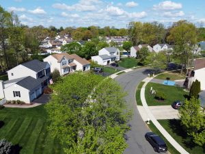Aerial view of an established residential neighborhood in Hamilton Township New Jersey with tree-lined streets and family homes