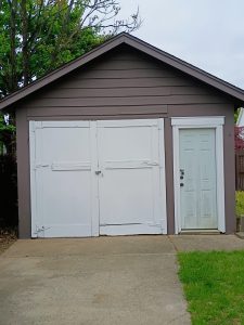 Detached garage in Hamilton NJ after exterior repairs and painting showing improved condition and appearance