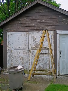 Detached garage in Hamilton NJ showing peeling paint and deferred exterior maintenance before repairs