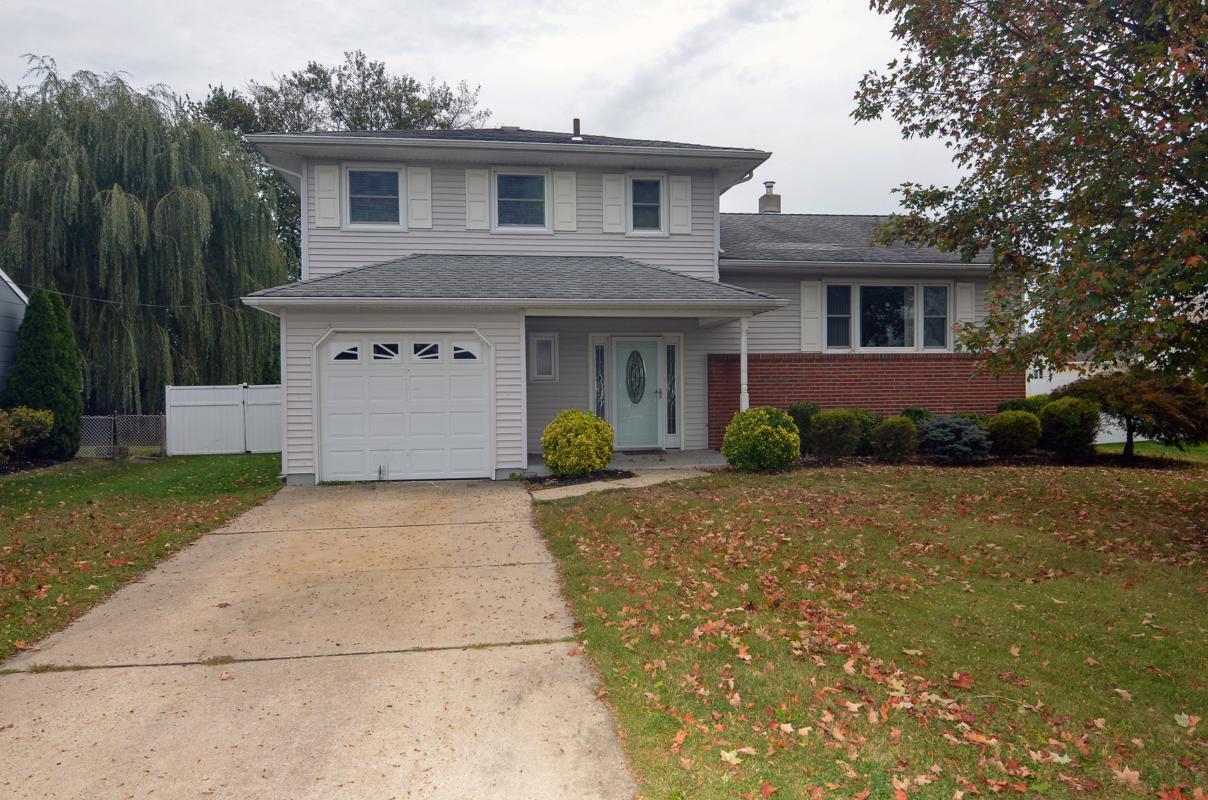 Front exterior of a two-story home on Apollo Drive in Hamilton Township NJ that marked the beginning of a client's long-term real estate investment journey.