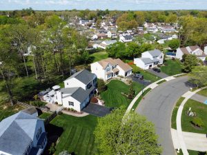 Aerial view of an established Hamilton Township neighborhood showing homes, streets, and surrounding residential development.