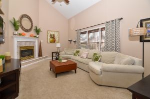 Inviting family room with a vaulted ceiling, fireplace, and comfortable seating in a Hamilton NJ home.