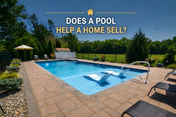 Inground swimming pool with paver patio, shallow-water seating, landscaping, and fenced backyard at a Hamilton NJ home.