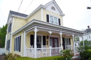 Victorian-style home in the Groveville section of Hamilton Township NJ featuring a large front porch, decorative trim, gabled rooflines, and traditional architectural details.