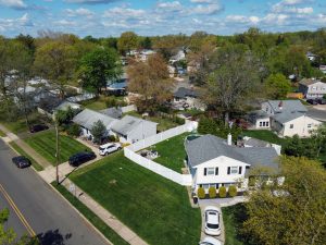 Aerial view of an established Hamilton NJ residential neighborhood showing multiple homes, yards, trees, and surrounding streets.