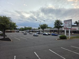 Wide view of Dover Park Plaza and its directory sign in the Yardville section of Hamilton Township NJ.