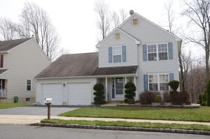 Two-story colonial home with a two-car garage in the Highlands neighborhood of Yardville in Hamilton Township NJ.